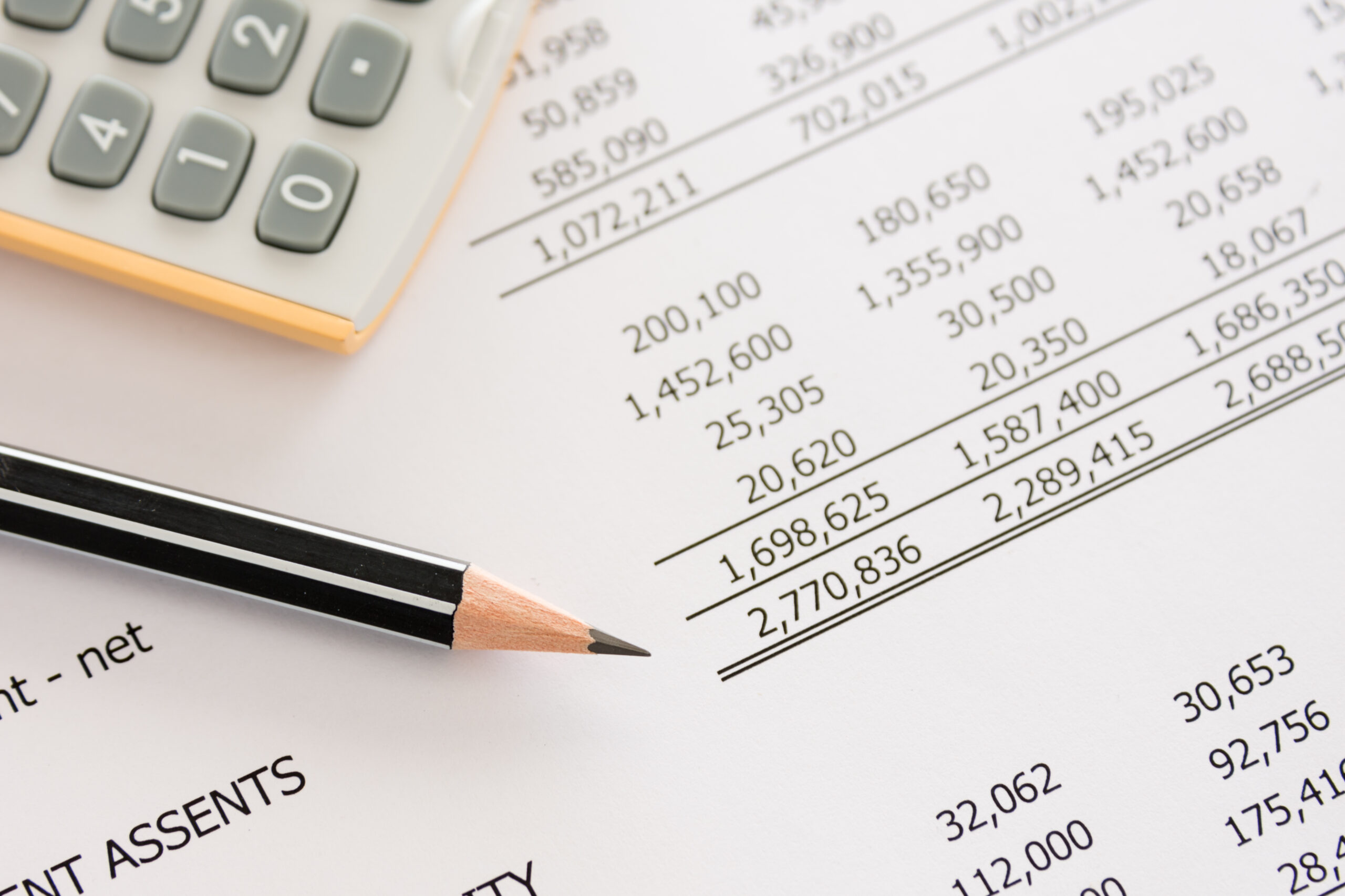 Balance sheet ,pencil, calculator on accountant's desk. Accounting , accounts concept. top view, above view